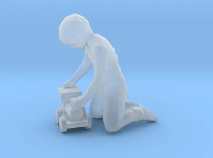 Child Kneeling W/Toy Train 1