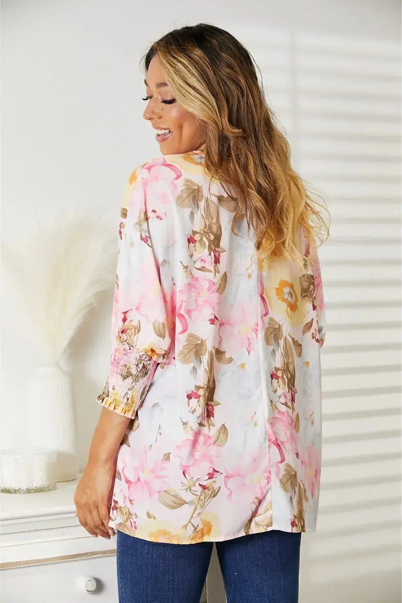 Floral Top Features A Classic Round Neck And Three-Quarter Sleeves 2
