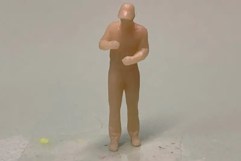 Man Standing Arms Bent With Cap 1