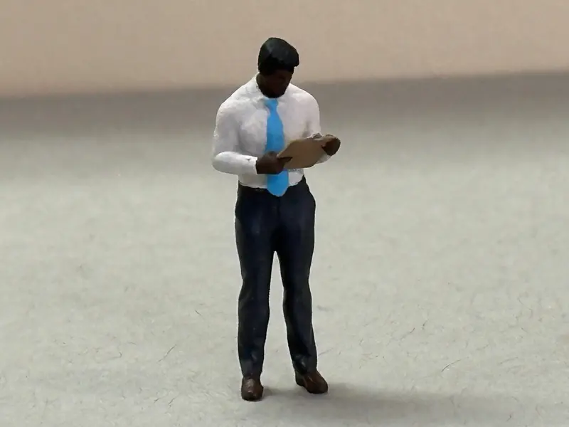 Man Standing Holding Clipboard 1